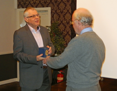 Graham Whiteley (left) being presented with an engraved glass by Dounlas Norris.