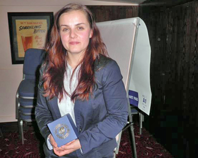 Maria Bacon having just been presented with a souvenir of the evening by the Chairman.
