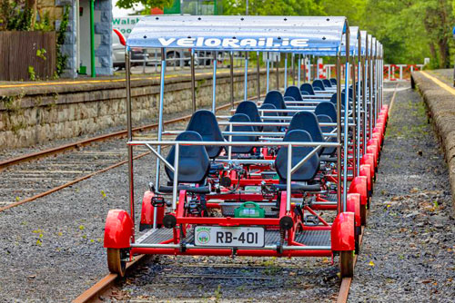 Velorail railbikes waiting for passengers at the station.